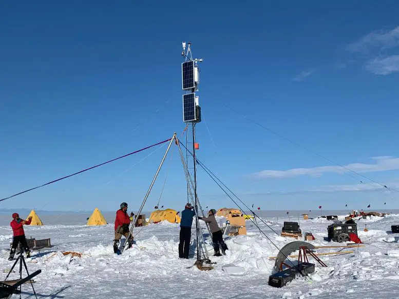 Researchers Erecting a Monitoring Tower With Atmospheric Sensors